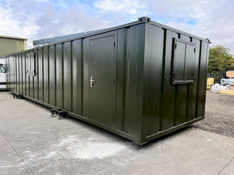 40 X 10 Foot Olive Green Anti Vandal Cabins awaiting delivery